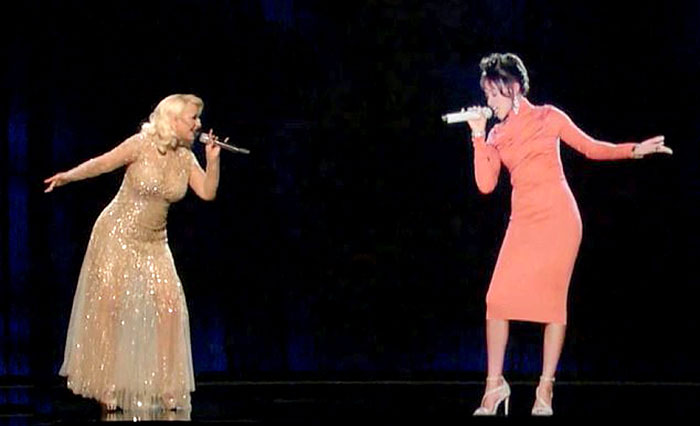 Впервые голограмму Уитни показали в 2016 году в дуэте с Кристиной Агилерой на американской версии телешоу «Голос»