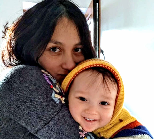 Жена Брайана Ева с их сыном Олином