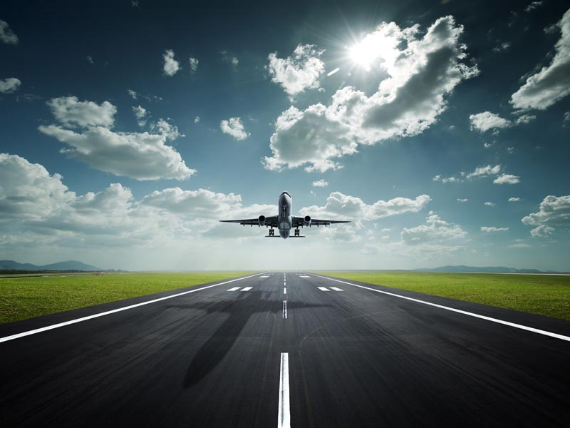Passenger-plane-take-off-airport-road-clouds-sun_2560x1920