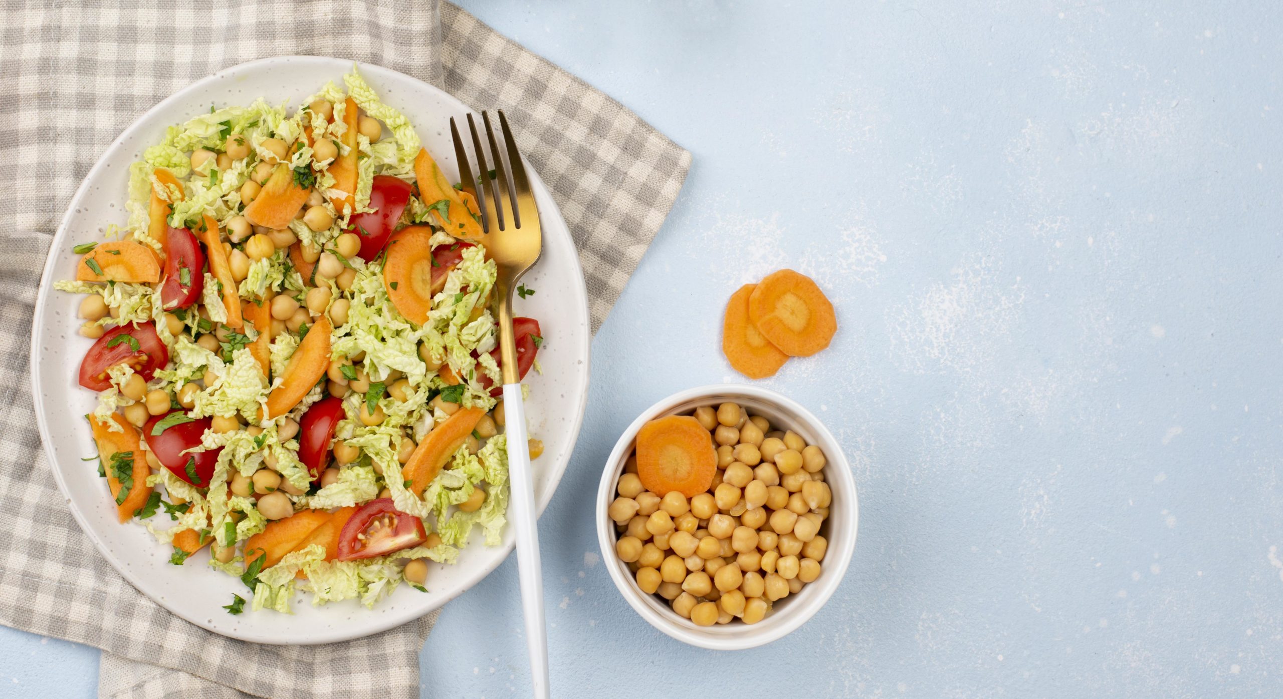 top-view-salad-with-chickpeas-carrots-copy-space